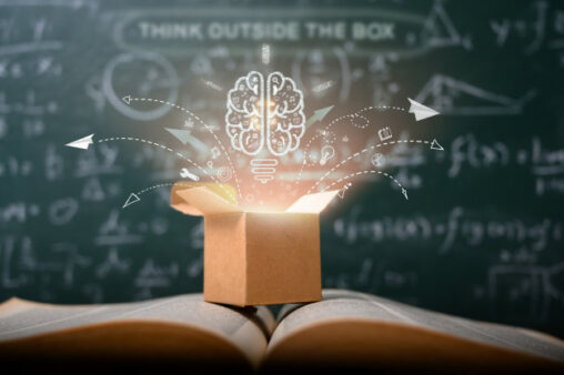 An open book with a box and a brain